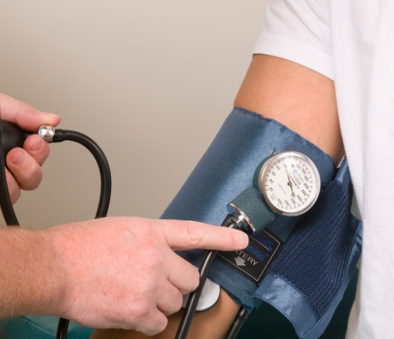 doctor checking blood pressure