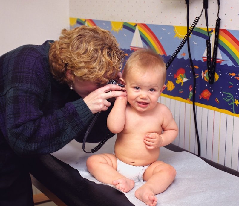 woman on phone with baby